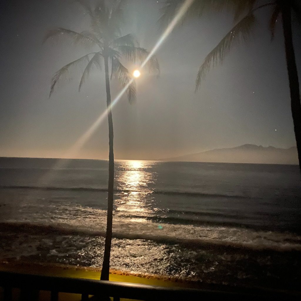 moon reflecting off a beach in Maui
