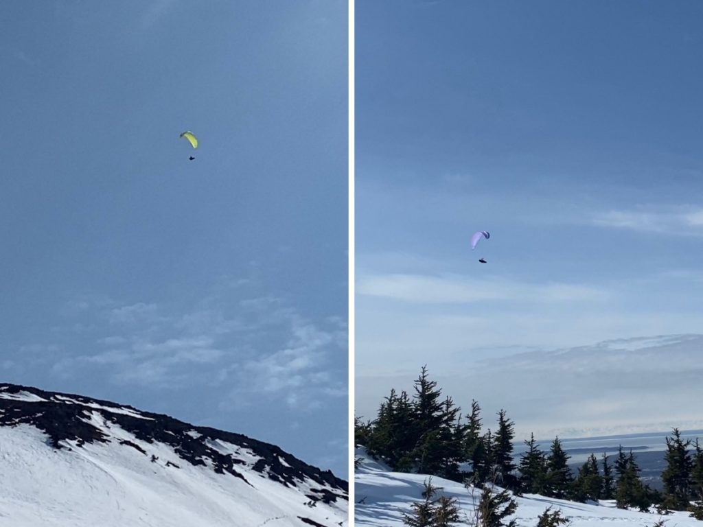Paragliders off of Flat Top Mountain